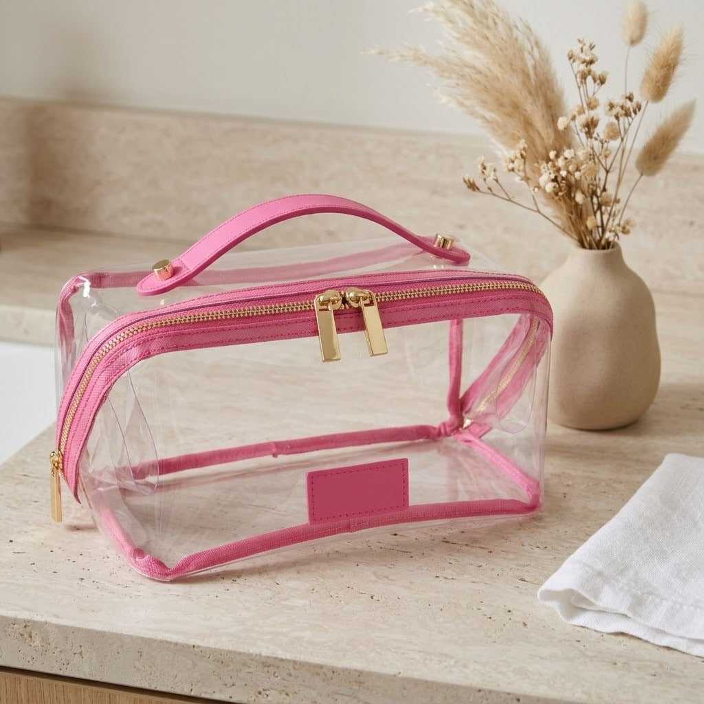 Clear flat lay makeup bag with pink trim