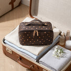 Medium flat lay makeup bag brown print in suitcase