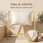 White satin pillowcase drying on a wooden rack